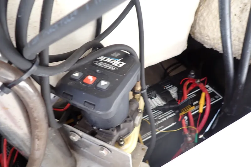 Slide: The Image of Boat battery compartment with wiring and control unit, Sailfish 245 DC, 2019 model. - 71