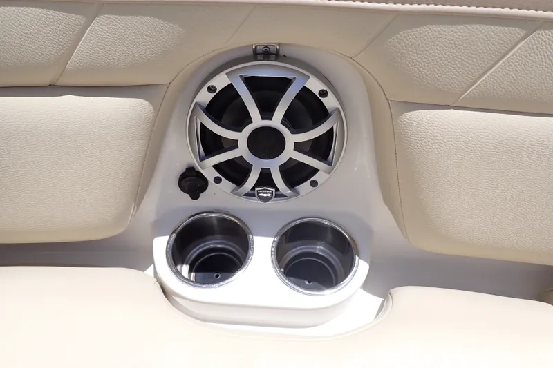 Slide: The Image of Speaker and cup holders on 2019 Sailfish 245 DC boat interior. - 47