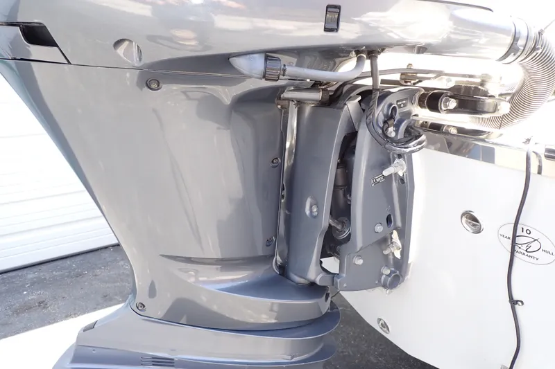 Slide: The Image of Close-up of a 2019 Sailfish 245 DC boat engine, showcasing mechanical details. - 105