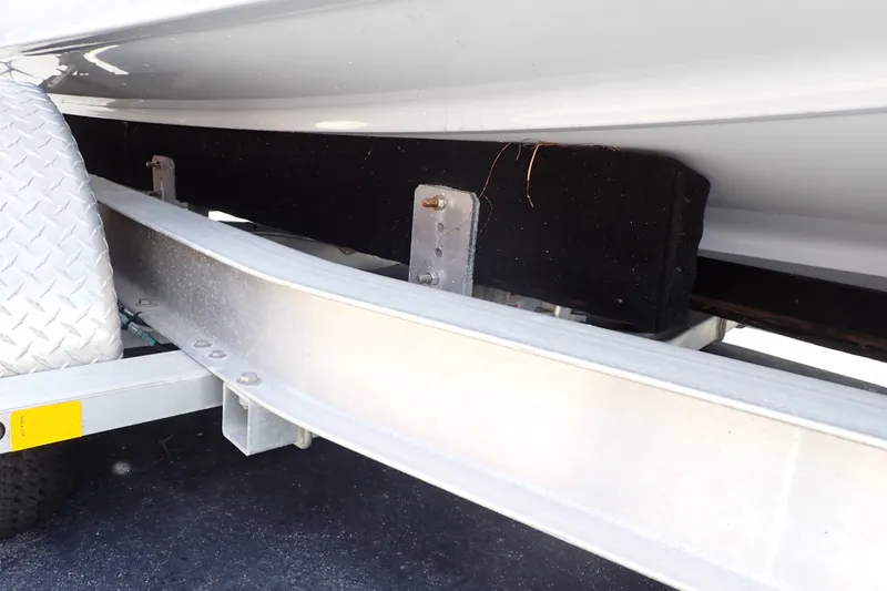 Slide: The Image of 2019 Sailfish 245 DC boat trailer detail with metal frame and protective padding. - 119