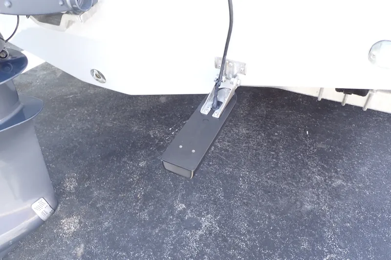 Slide: The Image of 2019 Sailfish 245 DC boat transom with mounted equipment and outboard motor. - 115