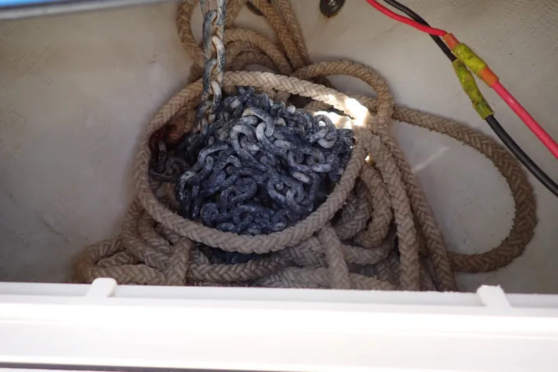 Slide: The Image of Anchor chain and rope storage in 2019 Sailfish 245 DC boat compartment. - 50