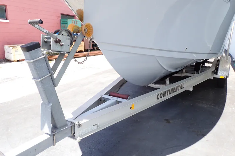 Slide: The Image of 2019 Sailfish 245 DC boat on Continental trailer, parked outdoors. - 125