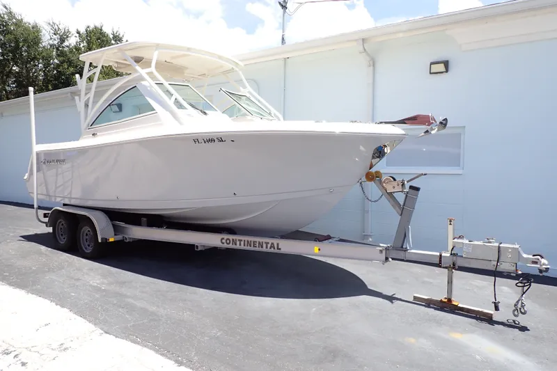 Slide: The Image of 2019 Sailfish 245 DC boat on Continental trailer, parked outdoors. - 102
