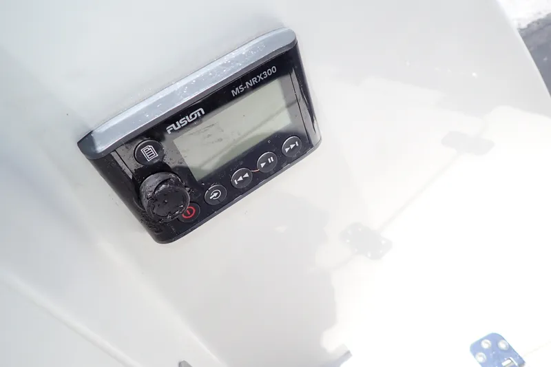 Slide: The Image of Fusion MS-NRX300 marine stereo on 2019 Sailfish 245 DC boat dashboard. - 101
