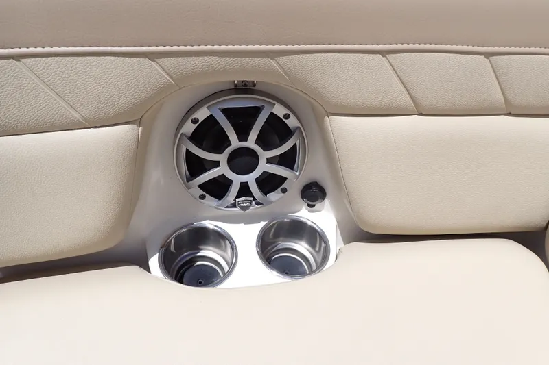 Slide: The Image of Speaker and cup holders on 2019 Sailfish 245 DC boat interior. - 53