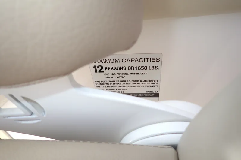 Slide: The Image of 2019 Sailfish 245 DC capacity label, maximum 12 persons or 1650 lbs. - 91
