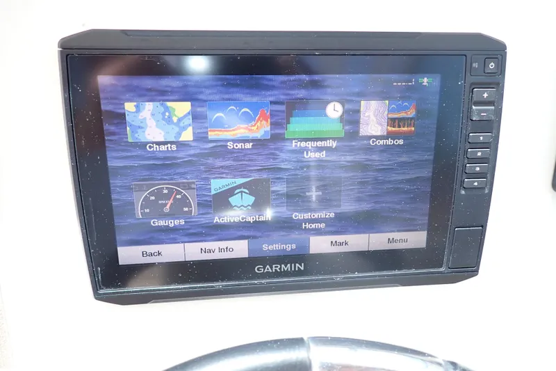 Slide: The Image of Garmin marine display on 2019 Sailfish 245 DC, showing navigation and sonar options. - 22