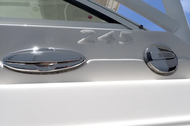 Slide: The Image of 2019 Sailfish 245 DC boat detail with chrome accents and gas cap. - 132