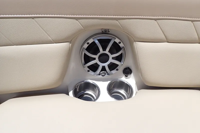 Slide: The Image of Speaker and cup holders on 2019 Sailfish 245 DC boat interior. - 48