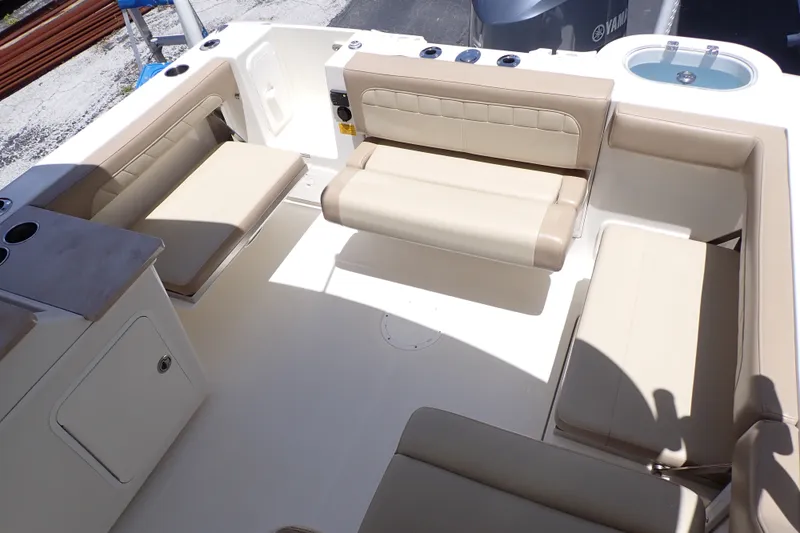 Slide: The Image of Spacious seating area on 2019 Sailfish 245 DC boat with beige upholstery. - 20