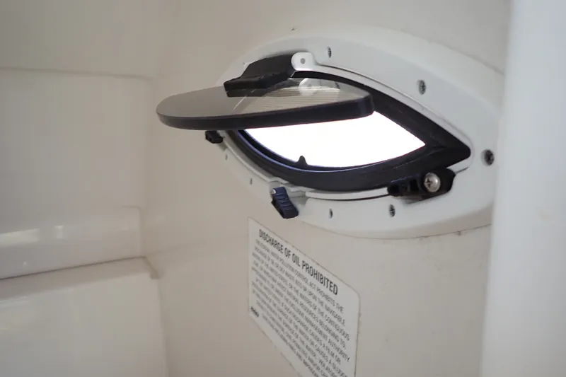 Slide: The Image of Open porthole window inside 2019 Sailfish 245 DC boat cabin. - 38