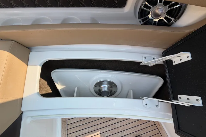 Slide: The Image of An open storage compartment on a 2020 Sea Ray SLX 310 Outboard boat. - 23