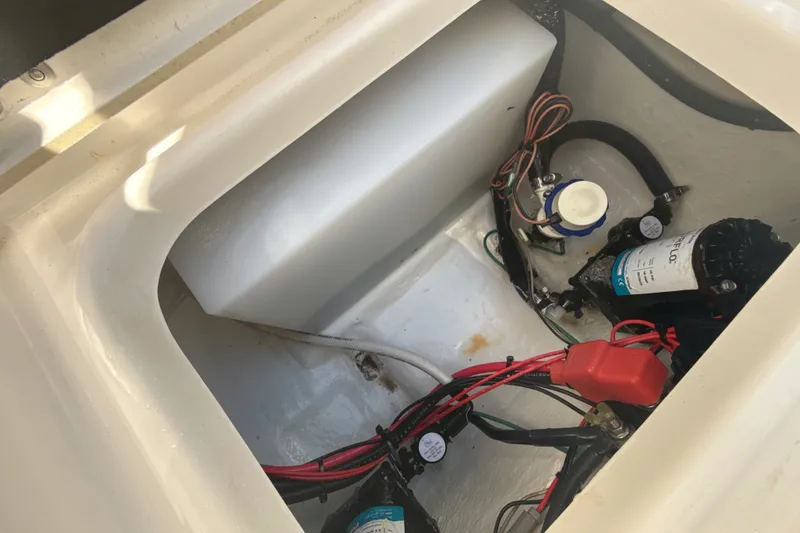 Slide: The Image of 2023 Tidewater 232 CC Adventure boat wiring and pump system. - 24