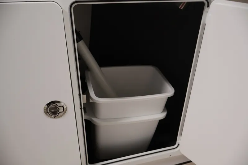 Slide: The Image of Storage compartment with bins on a 2026 Yamaha Boats 252 FSH Sport. - 20