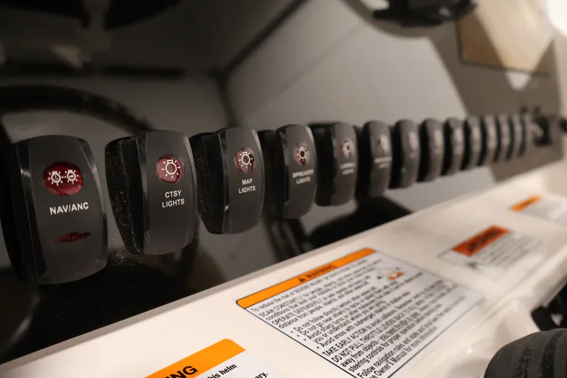 Slide: The Image of Control panel of 2026 Yamaha Boats 252 FSH Sport with labeled switches. - 30
