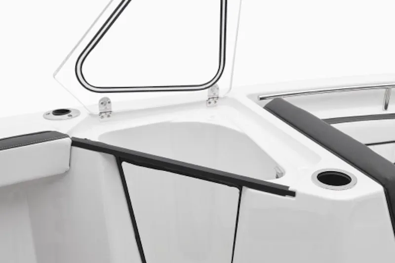 Slide: The Image of Open storage compartment on 2026 Yamaha Boats 252 FSH Sport, featuring sleek design and cup holder. - 1