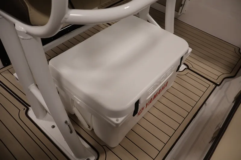 Slide: The Image of 2026 Yamaha Boats 252 FSH Sport deck with cooler and seating area. - 43