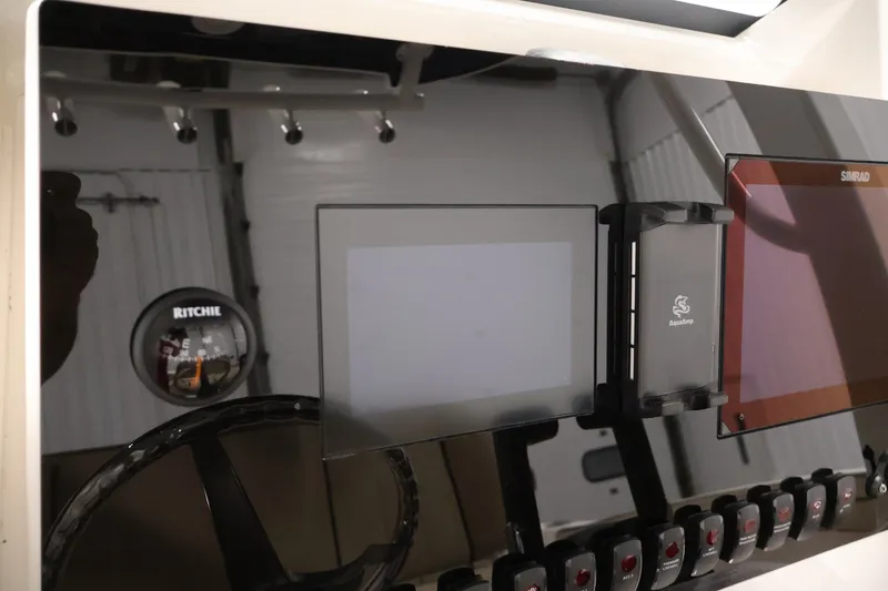 Slide: The Image of Dashboard of 2026 Yamaha Boats 252 FSH Sport with navigation and control systems. - 28
