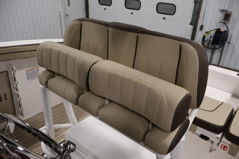 Slide: The Image of 2026 Yamaha Boats 252 FSH Sport interior seating, featuring luxurious tan upholstery. - 34