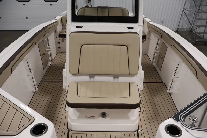 Slide: The Image of 2026 Yamaha Boats 252 FSH Sport interior with beige seating and sleek design. - 21