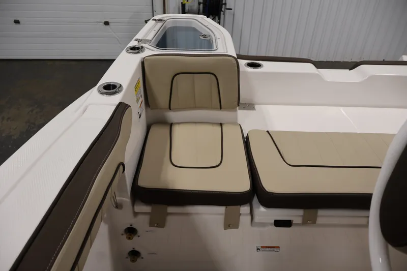 Slide: The Image of 2026 Yamaha Boats 252 FSH Sport interior seating with beige and brown cushions. - 37