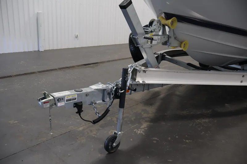 Slide: The Image of Trailer hitch of 2026 Yamaha Boats 252 FSH Sport in a garage setting. - 49