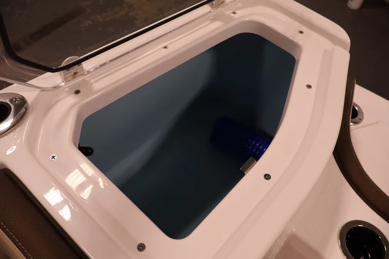 Slide: The Image of Open storage compartment on 2026 Yamaha Boats 252 FSH Sport, featuring sleek design and functionality. - 42