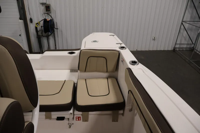 Slide: The Image of 2026 Yamaha Boats 252 FSH Sport interior seating with beige and brown cushions. - 35
