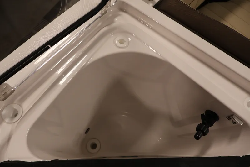 Slide: The Image of 2026 Yamaha Boats 252 FSH Sport storage compartment, featuring sleek white interior design. - 17