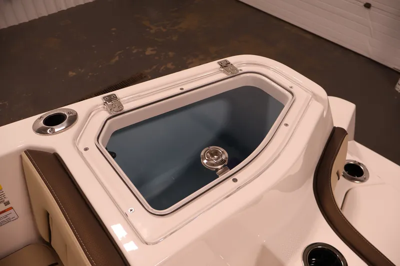 Slide: The Image of 2026 Yamaha Boats 252 FSH Sport livewell with stainless steel latch and cup holders. - 41