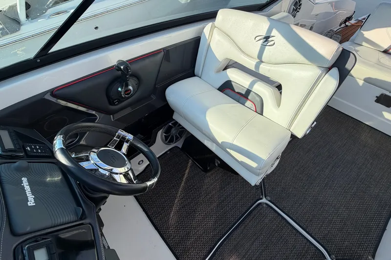 Slide: The Image of Interior of 2014 Monterey 288SS Super Sport boat with steering wheel and captain's chair. - 16