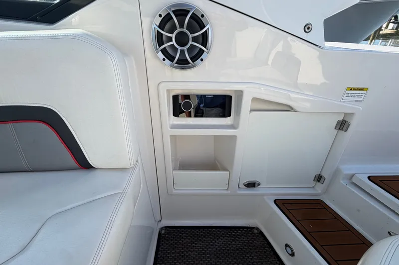 Slide: The Image of Interior of 2014 Monterey 288SS Super Sport boat with speaker and storage compartments. - 20