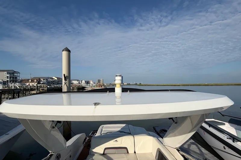 Slide: The Image of 2014 Monterey 288SS Super Sport boat docked under a clear blue sky. - 24