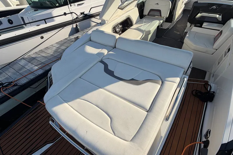 Slide: The Image of 2014 Monterey 288SS Super Sport boat with white seating and teak flooring. - 28