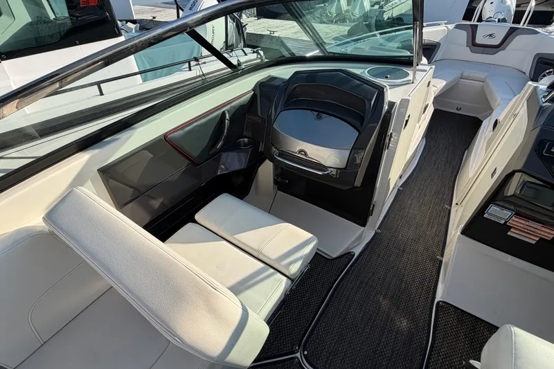 Slide: The Image of Interior of a 2014 Monterey 288SS Super Sport boat, featuring sleek seating and modern design. - 7