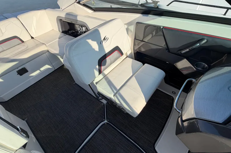 Slide: The Image of Interior of a 2014 Monterey 288SS Super Sport boat with white seating and modern design. - 9