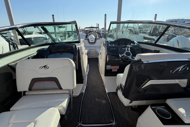 Slide: The Image of Interior view of a 2014 Monterey 288SS Super Sport boat at a marina. - 17
