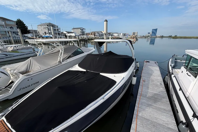 Slide: The Image of 2014 Monterey 288SS Super Sport boat docked at a marina with covered deck. - 33