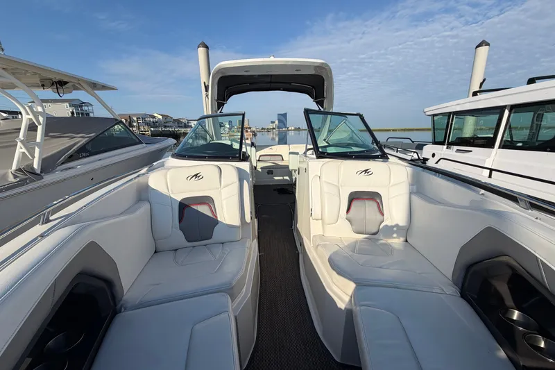 Slide: The Image of 2014 Monterey 288SS Super Sport boat interior with white seating and open deck. - 4