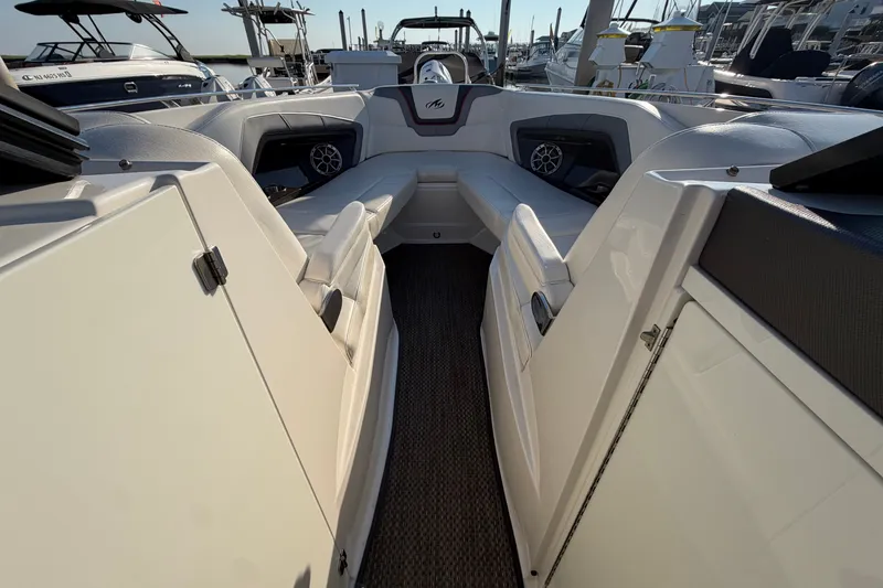 Slide: The Image of Interior view of a 2014 Monterey 288SS Super Sport boat at a marina. - 5