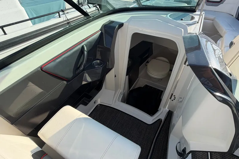 Slide: The Image of Interior view of 2014 Monterey 288SS Super Sport boat with open cabin door. - 8