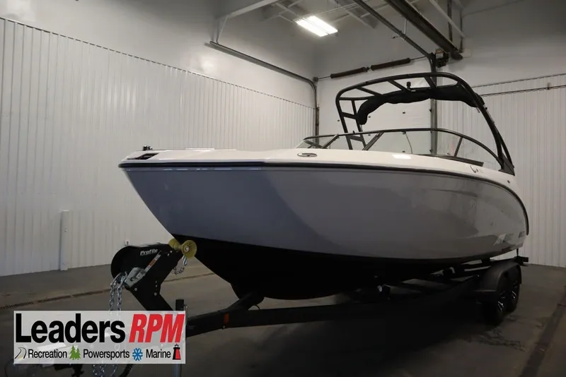 The Image of 2026 Yamaha Boats AR250 on trailer in indoor showroom. - 0