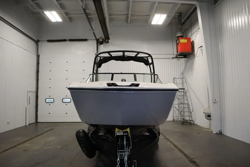 Slide: The Image of 2026 Yamaha Boats AR250 in a garage, front view showcasing sleek design. - 14
