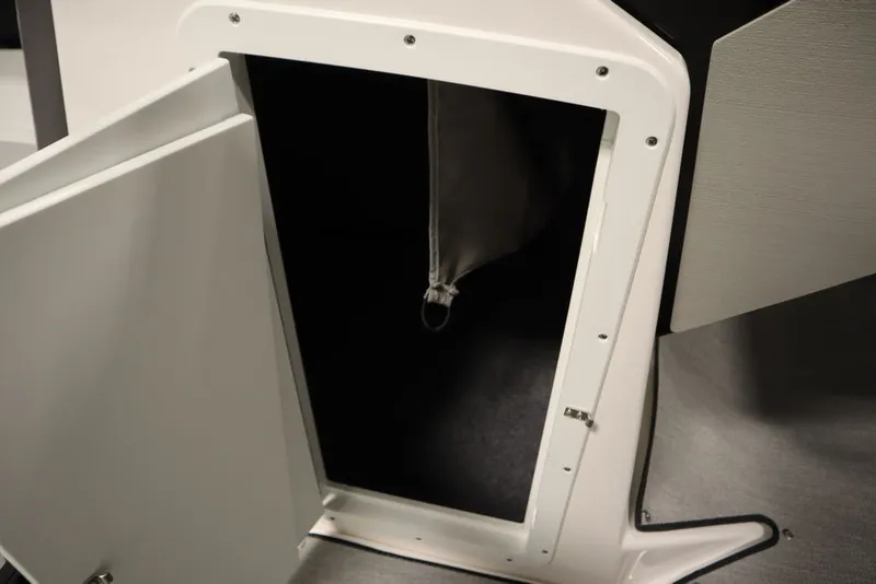 Slide: The Image of Open storage compartment on 2026 Yamaha Boats AR250, showcasing interior space. - 13