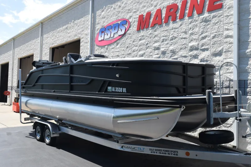 Slide: The Image of 2026 Evotti 523QL pontoon boat on trailer outside GSPS Marine building. - 2