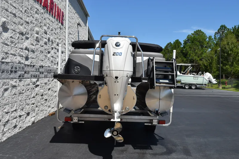 Slide: The Image of Evotti 523QL 2026 pontoon boat with powerful outboard motor, parked outdoors. - 5