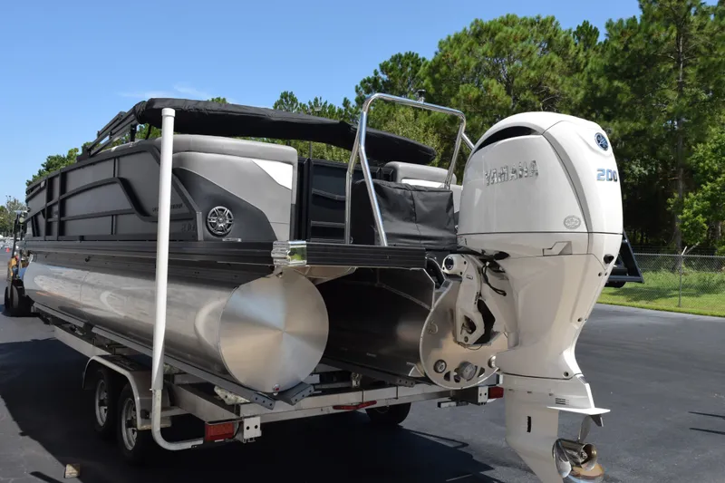 Slide: The Image of 2026 Evotti 523QL pontoon boat with Yamaha 200 outboard motor on trailer. - 6