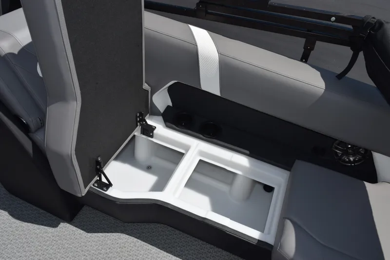 Slide: The Image of Open storage compartment in 2026 Evotti 523QL boat with gray seating. - 19