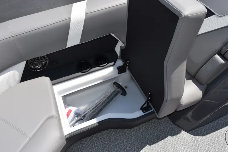 Slide: The Image of Interior storage compartment of 2026 Evotti 523QL boat with open seat and speaker. - 17